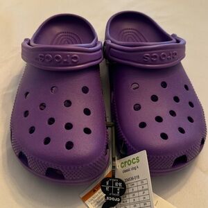 New with tags kid’s purple Crocs, size J6 (big kid 6).
